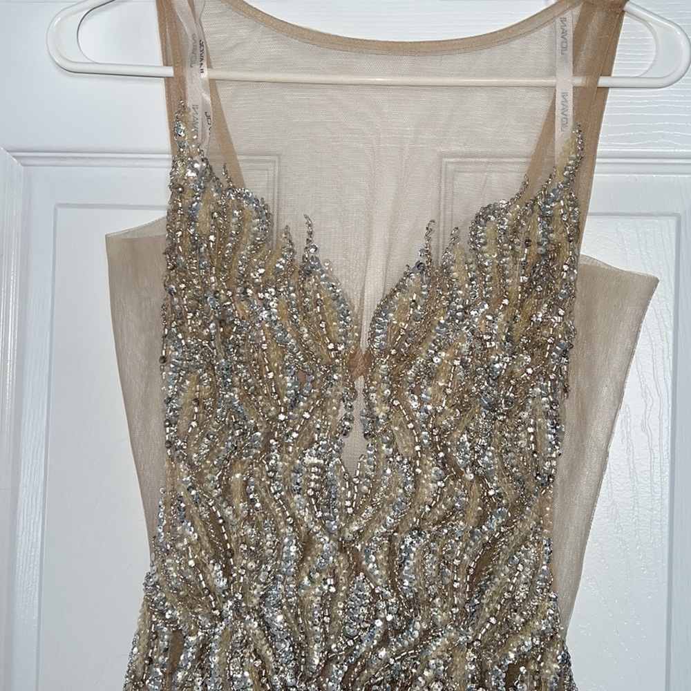 Selling size 2 Jovani nude prom dress with sequence.